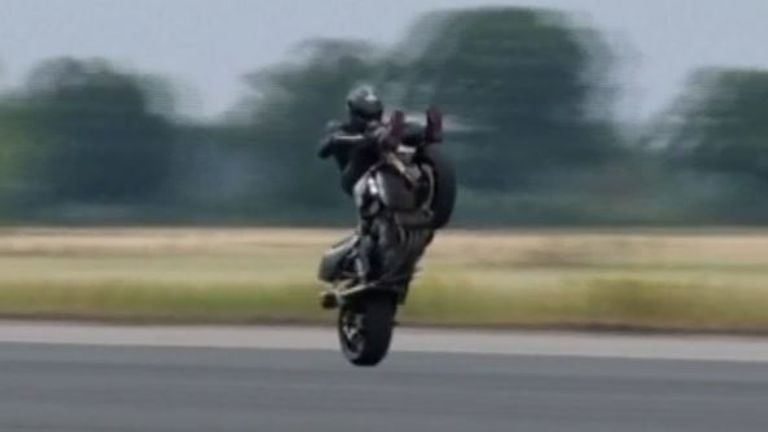 Motorcyclist performs fastest-ever handlebar wheelie | UK News | Sky News