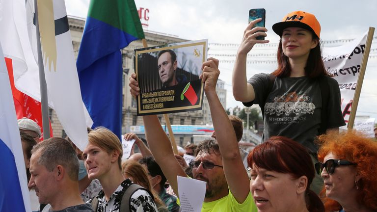 An anti-Kremlin protester&#39;s poster reads: "Navalny was poisoned. We know who is guilty. Alexei, live"