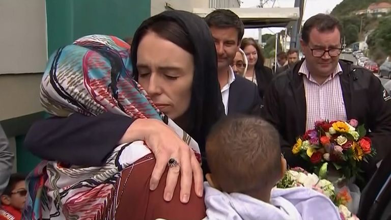 New Zealand Prime Minister Jacinda Ardern consoles a woman after the 2019 Christchurch mosque shooting.