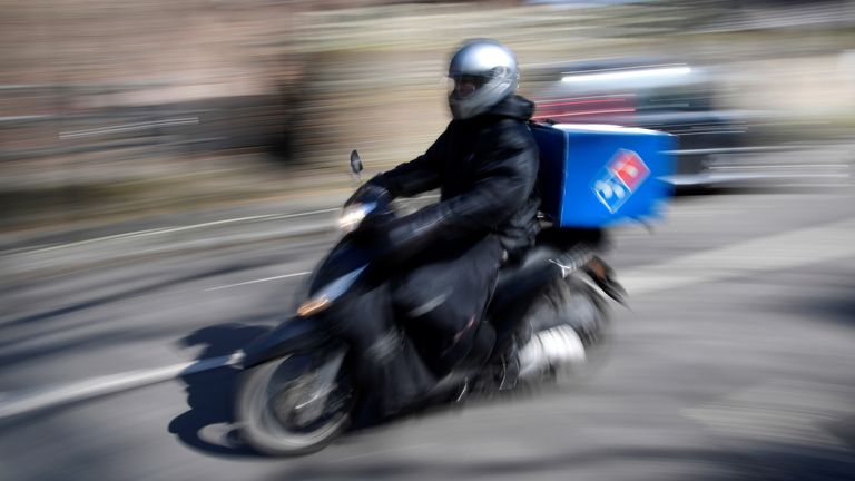 A Dominoes pizza delivery driver