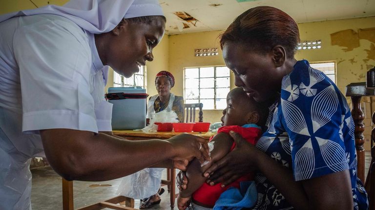 A child reacts as he receives an injection during the nationwide vaccination campaign against measles, rubella and polio targeting all children under 15 years old in Nkozi town, about 84 km from the capital Kampala, on October 19, 2019. - Uganda's Ministry of health with WHO and UNICEF aim to immunize more than 18 million children in Uganda which is about 43 percent of the population during their 5-day vaccination campaign. (Photo by Badru KATUMBA / AFP) (Photo by BADRU KATUMBA/AFP via Getty Ima