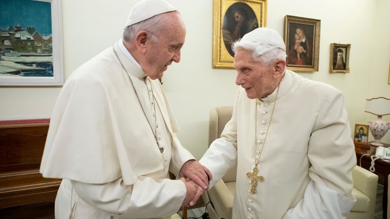 Benedict, right, was succeeded by Pope Francis, left