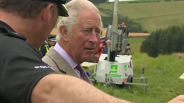 Prince Charles is shown the scene of a train derailment in Scotland