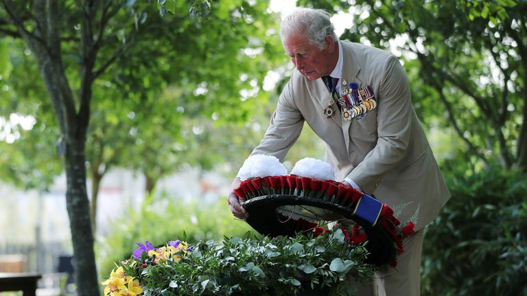 Prince Charles lays a wreath