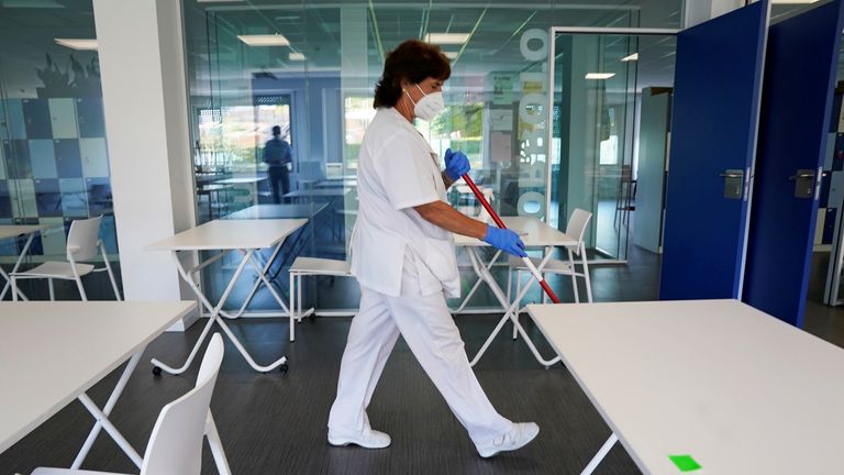 A cleaner prepares a school in San Sebastian for students