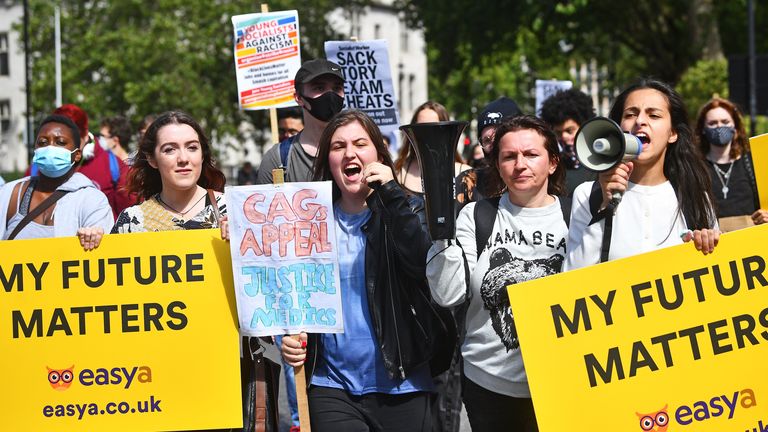Students take part in a march over the government&#39;s handling of exam results 