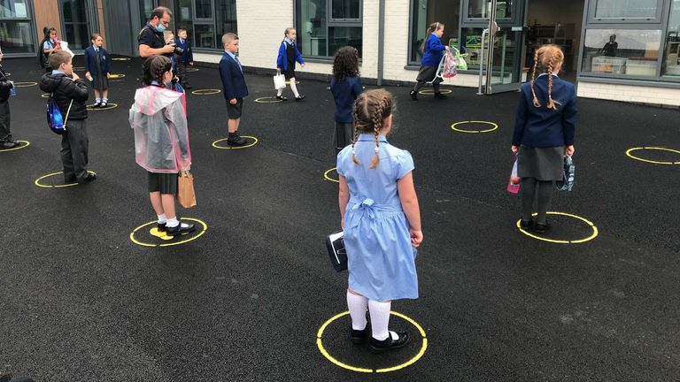 Upon arrival, each student at Tollbrae Primary School is asked to stand on  colour painted in circles on the tarmac.