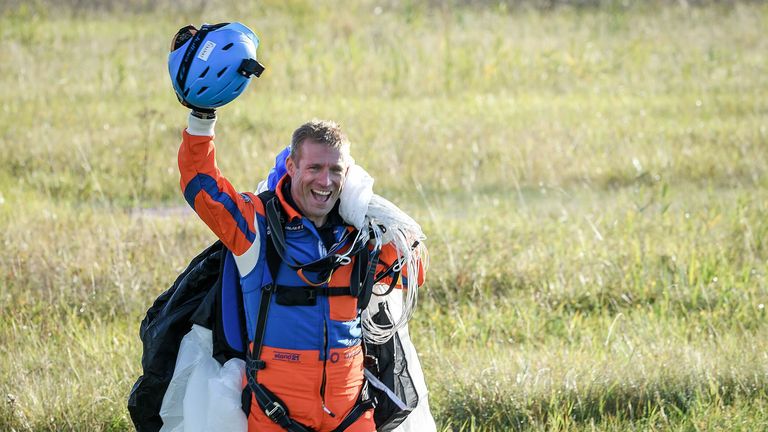 The founder of the SolarStratos plane project, Raphaël Domjan, lands after making the first ever parachute jump from a solar-powered plane