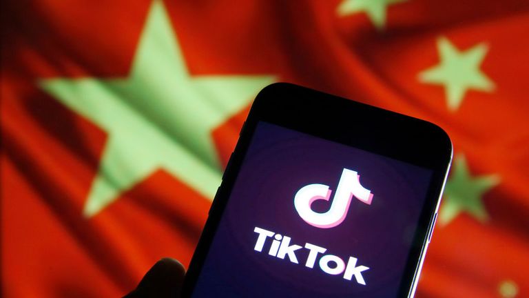 PARIS, FRANCE - DECEMBER 26: In this photo illustration the logo of Chinese media app for creating and sharing short videos, TikTok, also known as Douyin is displayed on the screen of a smartphone in front of a Chinese flag on December 26, 2019 in Paris, France. The social media app TikTok developed by Chinese company ByteDance continues its meteoric rise and exceeded the milestone of 1.5 billion downloads. Tik Tok now surpasses Facebook and Instagram. (Photo by Chesnot/Getty Images)
