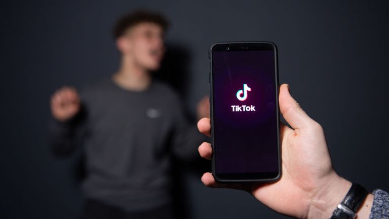 An AFP collaborator poses for a picture using the smart phone application TikTok on December 14, 2018 in Paris. - TikTok, is a Chinese short-form video-sharing app, which has proved wildly popular this year. (Photo by - / AFP) (Photo credit should read -/AFP via Getty Images)
