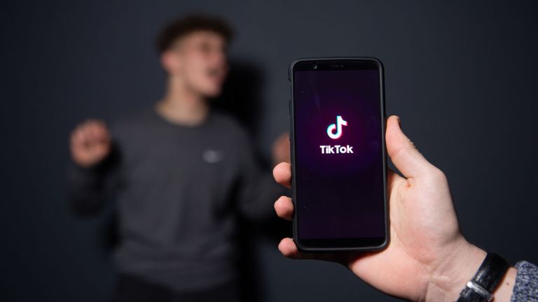 An AFP collaborator poses for a picture using the smart phone application TikTok on December 14, 2018 in Paris. - TikTok, is a Chinese short-form video-sharing app, which has proved wildly popular this year. (Photo by - / AFP) (Photo credit should read -/AFP via Getty Images)
