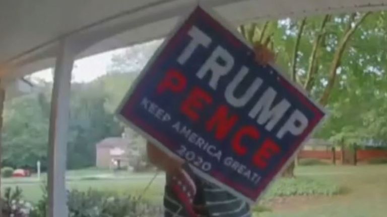 Man removes Trump Pence election sign from someone&#39;s front garden