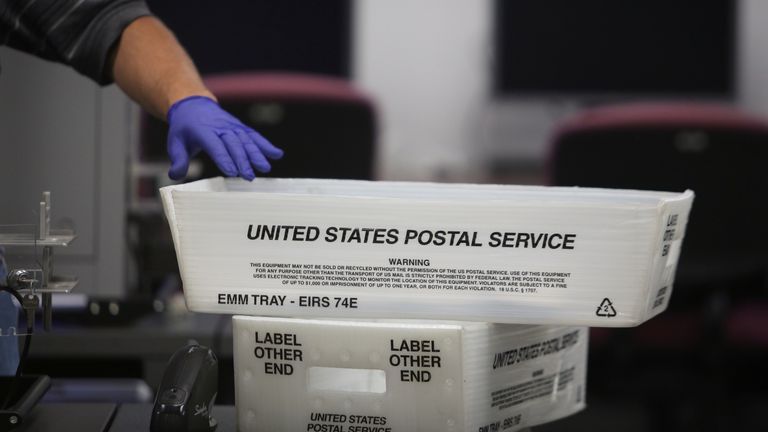 A US Postal Service basket with mail-in ballots in Florida in August