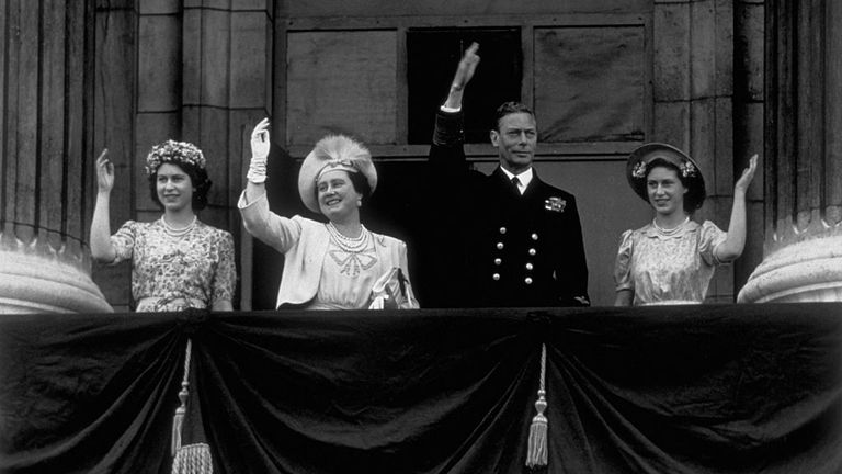 Princess Elizabeth, Queen Elizabeth, King George VI and Princess Margaret waved from the Buckingham Palace balcony as crowds gathered to celebrate