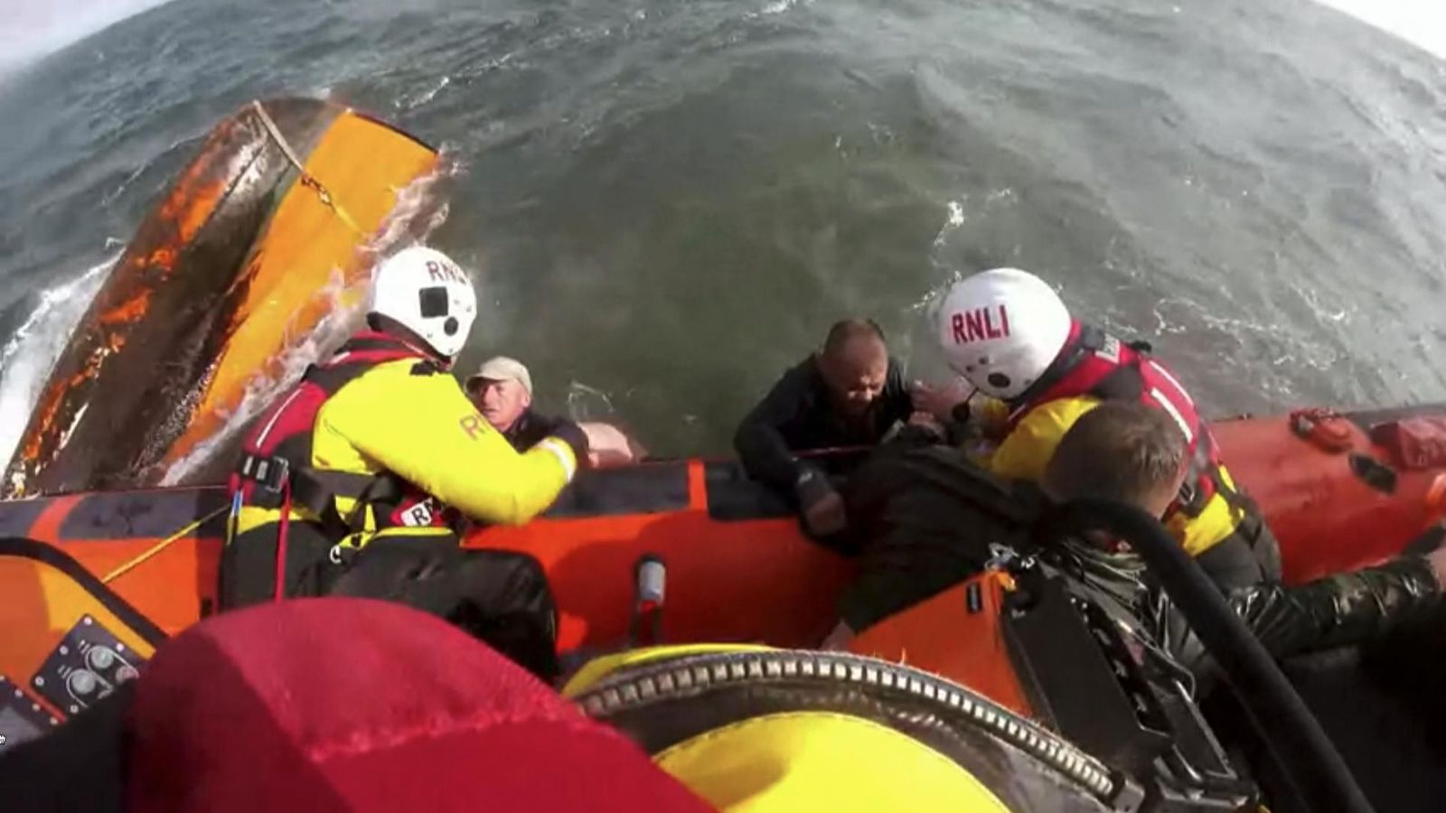 Moment Fishermen Rescued After Boat Capsizes | UK News | Sky News