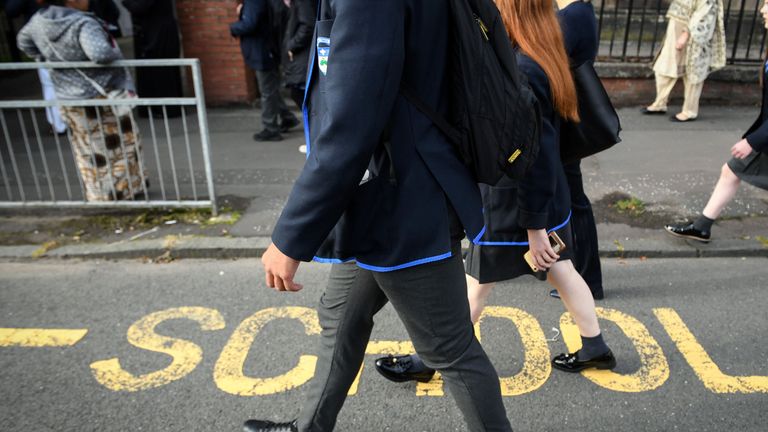 Pupils return to Holyrood Secondary School in Glasgow for the first time following the easing of coronavirus lockdown measures on August 12, 2020. - It will be the first time since March that Scottish pupils will have attended schools. (Photo by Andy Buchanan / AFP) (Photo by ANDY BUCHANAN/AFP via Getty Images)