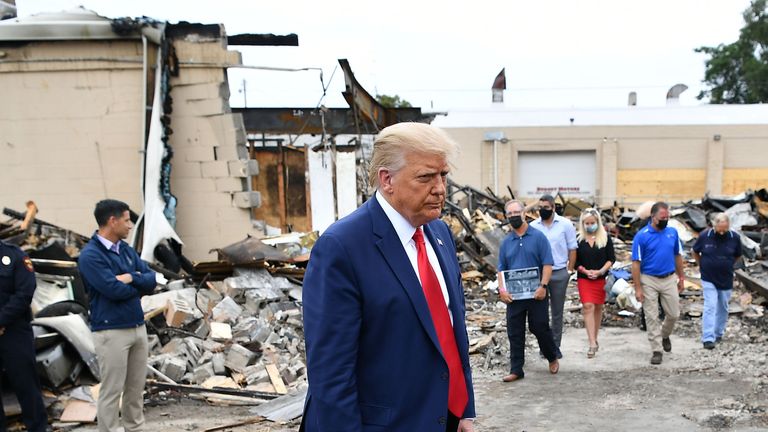 US President Donald Trump tours an area affected by civil unrest in Kenosha, Wisconsin on September 1, 2020. - Trump visited Kenosha, the Wisconsin city at the center of a raging US debate over racism, despite pleas to stay away and claims he is dangerously fanning tensions as a reelection ploy. (Photo by MANDEL NGAN / AFP) (Photo by MANDEL NGAN/AFP via Getty Images)