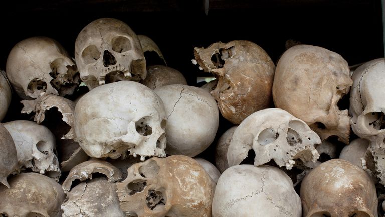 PHNOM PENH, CAMBODIA-JULY 26 : Some of the 8,000 human skulls sit in a glass case at the Choeung Ek Genocidal Center where July 26, 2010 in Phnom Penh province. Today the UN -backed Khmer Rouge tribunal convicted Kaing Guek Eav, also known as "Duch", to 35 years in prison. He was the prison chief and has acknowledged responsibility for overseeing the torture and execution of more than 15,000 people at the notorious S-21 prison known as Tuol Sleng. Kaing Guek Eay, 67 will serve only 19 years of the sentence since he already spent 11 years awaiting the trial in detention.  (Photo by Paula Bronstein/ Getty Images)