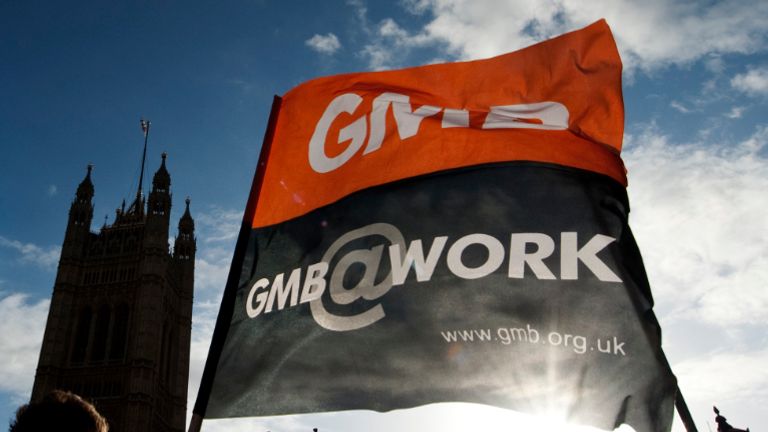 GMB trade union members demonstrate supporting a public sector strike over pensions outside the  in London on November 30, 2011. Up to two million public sector workers in Britain went on strike over changes to their pensions, after the government responded to slashed growth forecasts with fresh spending cuts. AFP PHOTO / ADRIAN DENNIS (Photo credit should read ADRIAN DENNIS/AFP via Getty Images)