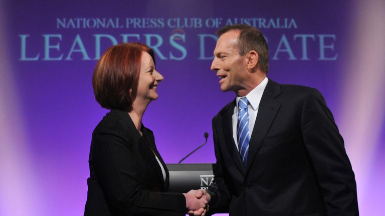 CANBERRA, AUSTRALIA - JULY 25: Australian Prime Minister Julia Gillard shakes hands with Opposition Leader Tony Abbott ahead of the first leaders debate at the National Press Club on July 25, 2010 in Canberra, Australia. Gillard and Abbott will go head-to-head in what is expected to be the only debate prior to the August 21 federal election. The debate was brought forward from its traditional time of 7:30pm to avoid a clash with the popular cooking show MasterChef. (Photo by Alan Porritt-Pool/Getty Images)
