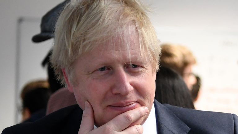 Britain's Prime Minister Boris Johnson reacts as he listens to students solving maths questions during his visit to the Department of Mathematics at King's Maths School, part of King's College London University, in central London on January 27, 2020. - Britain on Sunday announced a new fast-track visa scheme for top scientists, researchers and mathematicians as it prepares a new immigration system for life outside the European Union. Prime Minister Boris Johnson revealed the plan just days before Brexit finally takes place on January 31. (Photo by DANIEL LEAL-OLIVAS / POOL / AFP) (Photo by DANIEL LEAL-OLIVAS/POOL/AFP via Getty Images)