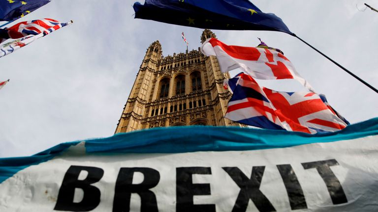 TOPSHOT - A pro-Brexit banner is seen outside the Houses of Parliament in London on October 30. 2019. - Britain&#39;s political leaders tested their election pitches today after parliament backed Prime Minister Boris Johnson&#39;s bid for a pre-Christmas poll aimed at breaking the years-long Brexit impasse. (Photo by Tolga AKMEN / AFP) (Photo by TOLGA AKMEN/AFP via Getty Images)