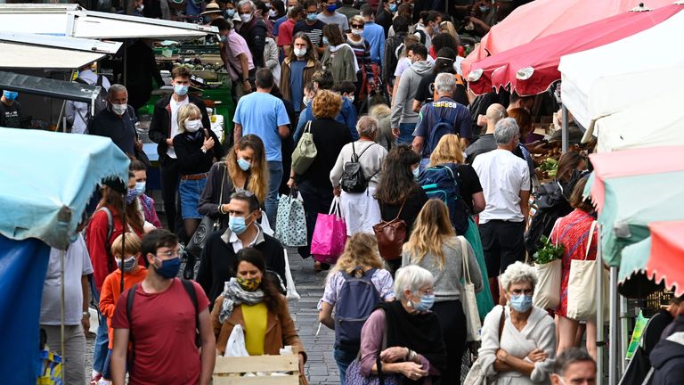 People wearing a protective mask to curb the spread of the novel coronavirus (Covid-19) shop at a market on September 12, 2020 in Rennes, western France. - The evolution of the epidemiological situation of the coronavirus in France shows &#34;an obvious deterioration&#34;, the French Prime Minister declared on September 11. (Photo by Damien MEYER / AFP) (Photo by DAMIEN MEYER/AFP via Getty Images)