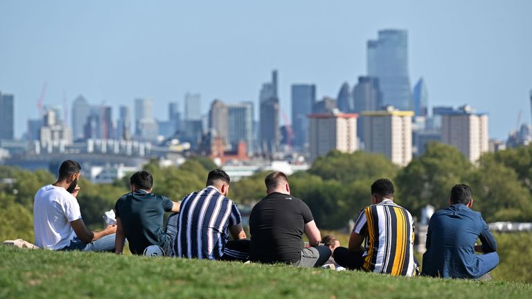 People gather on Primrose Hill in central London in the late summer sunshine on September 13, 2020, the day before the UK government brings in tightened coronavirus restrictions owing to a sharp rise in cases nationwide. - The new "rule of six" in England will replace a raft of "complicated and confusing" regulations and help reverse the upward trend of infections. (Photo by JUSTIN TALLIS / AFP) (Photo by JUSTIN TALLIS/AFP via Getty Images)