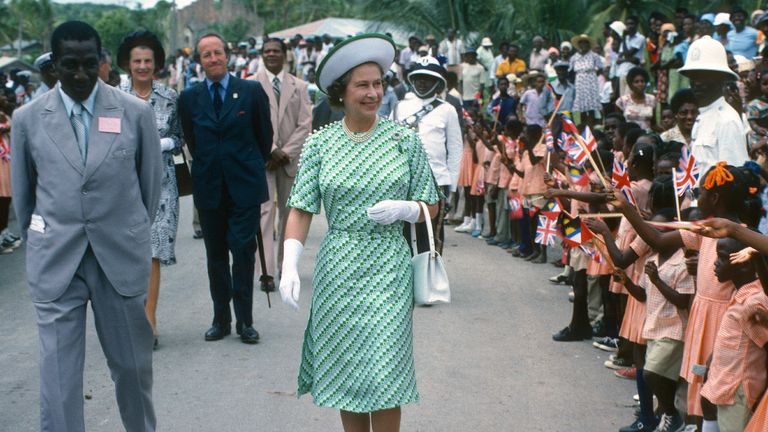 BARBADOS - NOVEMBER 01: Queen Elizabeth ll is greeted by the public during a walkabout in Barbados on November 01, 1977 in Barbados. (Photo by Anwar Hussein/Getty Images)
