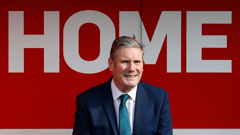 WALSALL, ENGLAND - SEPTEMBER 19: Labour Leader Keir Starmer watches a children's training session from a dugout during a visit of Walsall Football Club on September 19, 2020 in Walsall, England.  Starmer visited the club to learn about the club's community work during the pandemic and discuss their efforts to reopen sports stadium in a Covid-secure way. (Photo by Darren Staples/Getty Images)