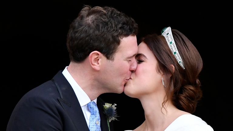 WINDSOR, ENGLAND - OCTOBER 12: Jack Brooksbank and Princess Eugenie of York share a kiss as they leave their wedding at St George's Chapel on October 12, 2018 in Windsor, England.  (Photo by Toby Melville - WPA Pool / Getty Images)