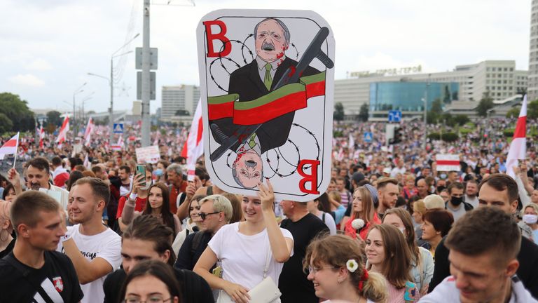 Belarus opposition supporters marching through the city