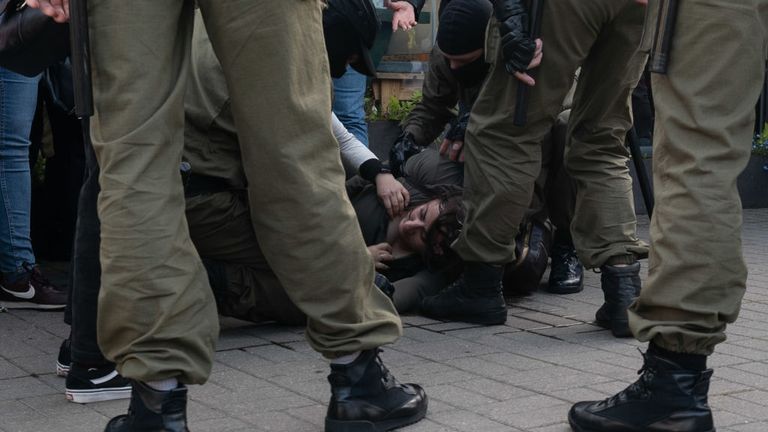 MINSK, BELARUS - SEPTEMBER 19: A woman suffers head injuries as peaceful protesters are encircled by police and arrested en masse during a women&#39;s march on September 19, 2020 in Minsk, Belarus. Women have been at the forefront of Belarus&#39;s protest movement following the disputed August 9th presidential election, which government critics allege was rigged in favor of current President Alexander Lukashenko. (Photo by Jonny Pickup/Getty Images)
