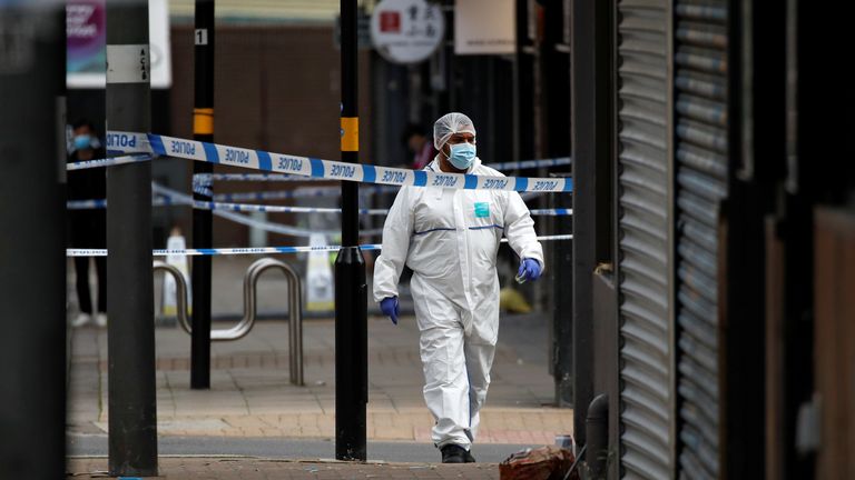 A forensic officer walks in the city centre after reported stabbings in Birmingham, Britain, September 6, 2020