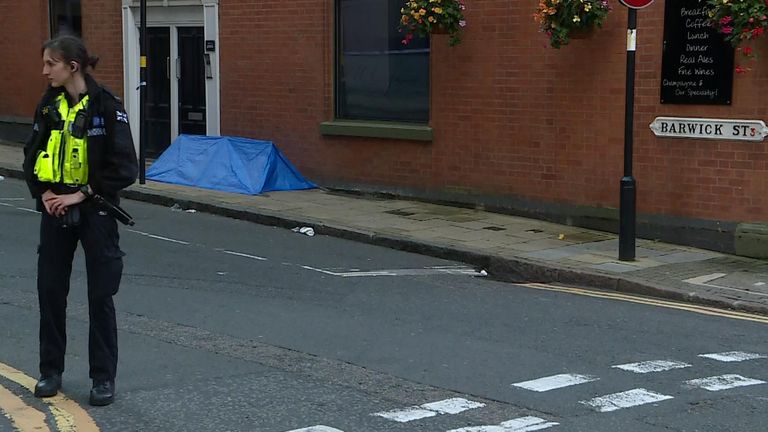 A body tent can be seen on Barwick Street in Birmingham city centre