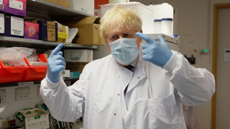 Britain&#39;s Prime Minister, Boris Johnson gestures during a visit to the Jenner Institute on September 18, 2020 in Oxford, England