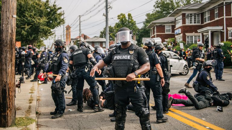 Police officers make arrests during protests on Wednesday