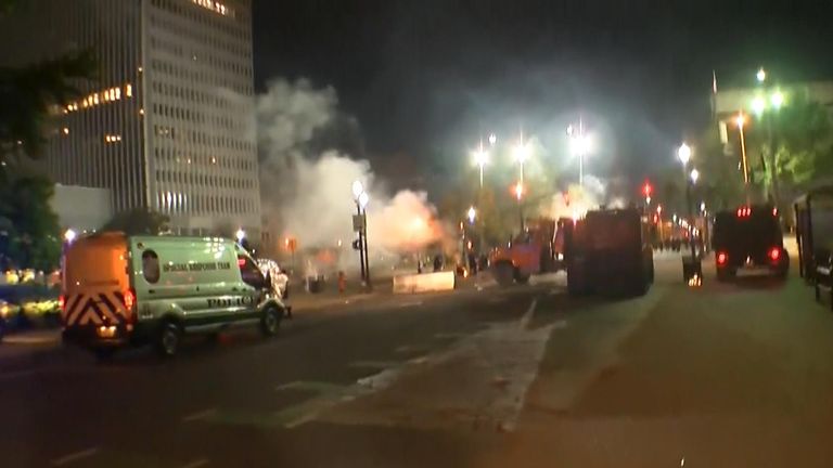 Protesters and police clash in Louisville, Kentucky following the decision not to charge officers directly involved in the shooting of Breonna Taylor  