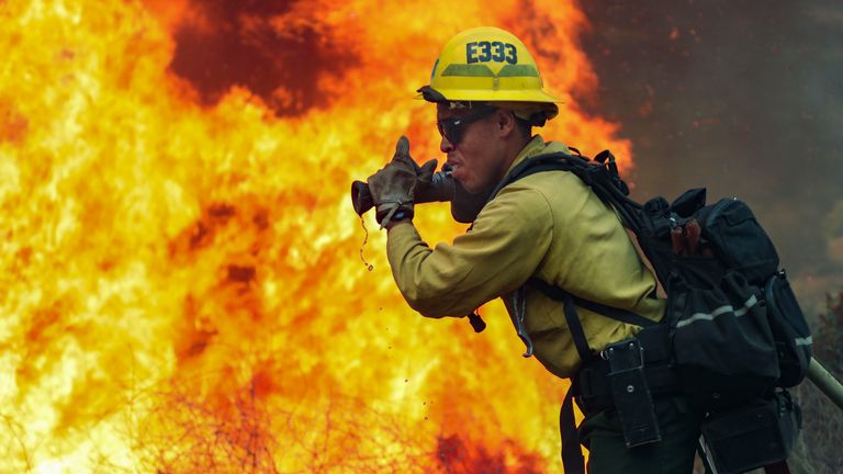Firefighters battle part of the Valley Fire in Jamul, California