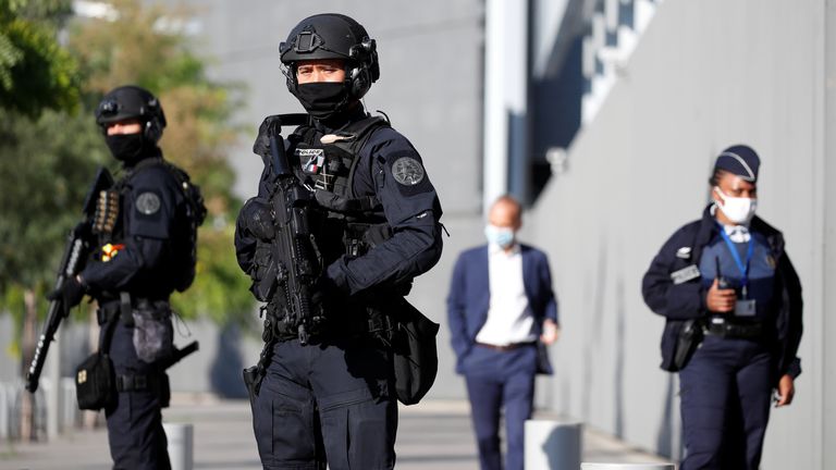 Police secure an entrance at the courthouse