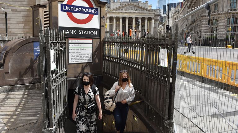 LONDON, ENGLAND - AUGUST 20: Women wearing a face masks exit Bank underground station on August 20, 2020 in London, England. Latest figures show a rise Covid-19 in a number of London boroughs with Richmond Upon Thames seeing a big jump. (Photo by John Keeble/Getty Images)