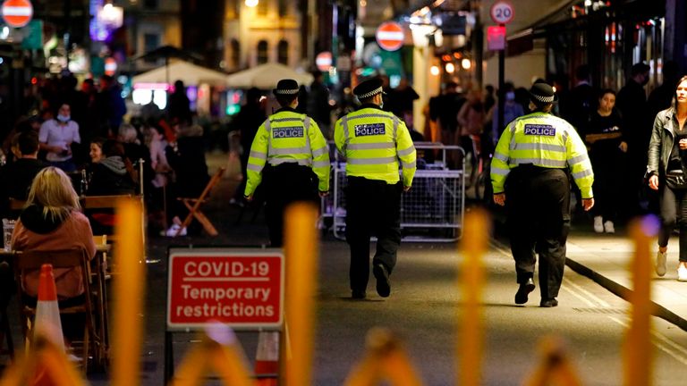 Police patrol in Soho, in central London on September 24, 2020, on the first day of the new earlier closing times for pubs and bars in England and Wales,