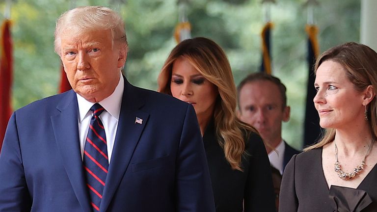 WASHINGTON, DC - SEPTEMBER 26: U.S. President Donald Trump (L) arrives to introduce 7th U.S. Circuit Court Judge Amy Coney Barrett as his nominee to the Supreme Court in the Rose Garden at the White House September 26, 2020 in Washington, DC. With 38 days until the election, Trump tapped Barrett to be his third Supreme Court nominee in just four years and to replace the late Associate Justice Ruth Bader Ginsburg, who will be buried at Arlington National Cemetery on Tuesday. (Photo by Chip Somode
