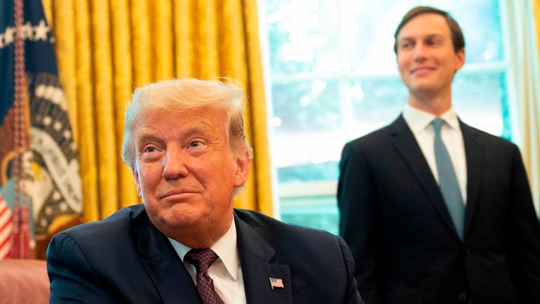 Donald Trump in the Oval Office with his veteran adviser Jared Kushner