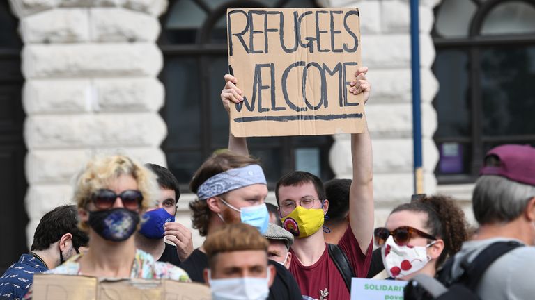 Pro-migrant supporters during a 'solidarity stand' in Dover's Market Square in support of the refugees crossing the Channel to Kent 