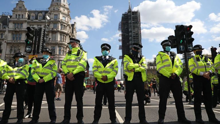 A line of police officers block a road during Extinction Rebellion protests in central London
