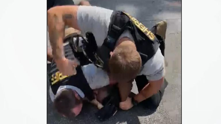 An officer was filmed punching Roderick Walker