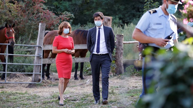 French Agriculture Minister Julien Denormandie speaks with horse breeder Mireille Didier 