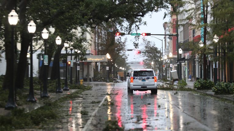 Hurricane Sally Makes Landfall On Gulf Coast
MOBILE, ALABAMA - SEPTEMBER 16: A police vehicle drives through a street strewn with tree branches as the winds and rain from Hurricane Sally pass through the area on September 16, 2020 in Mobile, Alabama. Mr. Hollyhand evacuated from his home to spend the night in the hotel. The storm is bringing heavy rain, high winds and a dangerous storm surge to the area. (Photo by Joe Raedle/Getty Images)