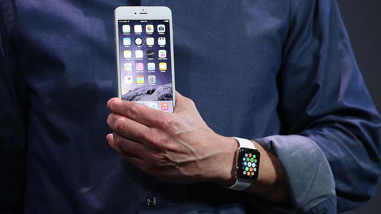 CUPERTINO, CA - SEPTEMBER 09: Apple CEO Tim Cook shows off the new iPhone 6 and the Apple Watch during an Apple special event at the Flint Center for the Performing Arts on September 9, 2014 in Cupertino, California. Apple is expected to unveil the new iPhone 6 and wearble tech. (Photo by Justin Sullivan/Getty Images)
